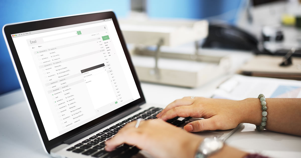 Writer typing up an email