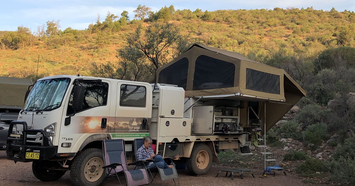 Peta M. working outside by camper in Australia&rsquo;s Outback