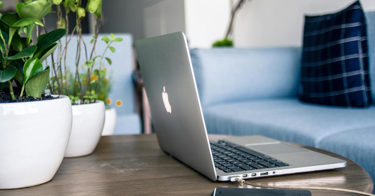 Laptop sitting on a coffee table