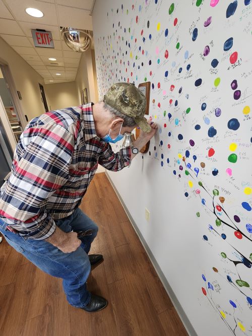 Rebecca&rsquo;s husband, Ross, got to sign the wall
	at the radiology center when he completed
	his final treatment in San Antonio. Copywriting
	allowed Rebecca to take him to every treatment
	and live in a hotel for months.